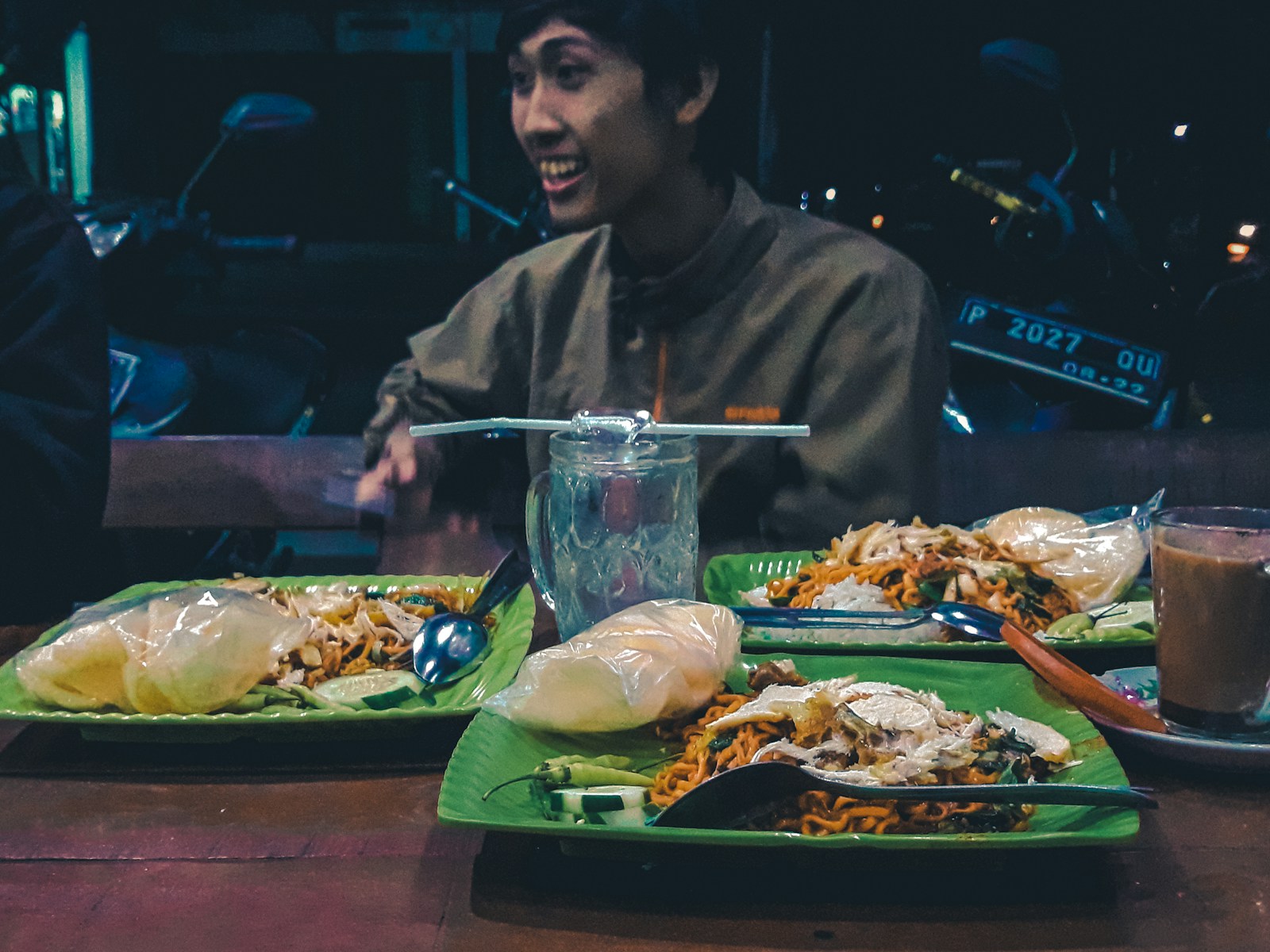 man beside beside plate of food