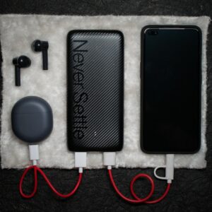 black iphone 5 c beside white usb cable